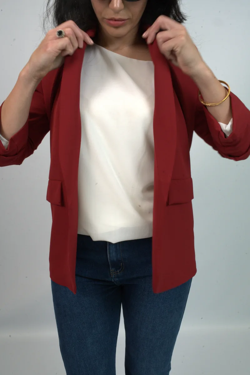 Kurt Muller womenswear campaign — red blazer over white