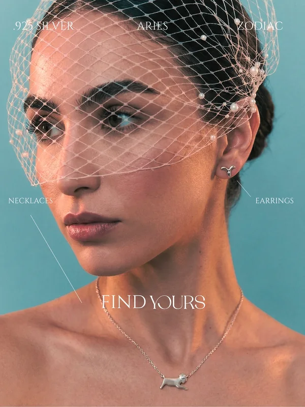 LoveYours Collection Aries zodiac campaign, Amaya Lala in a crystal birdcage veil, eyes lowered, warm beauty editorial